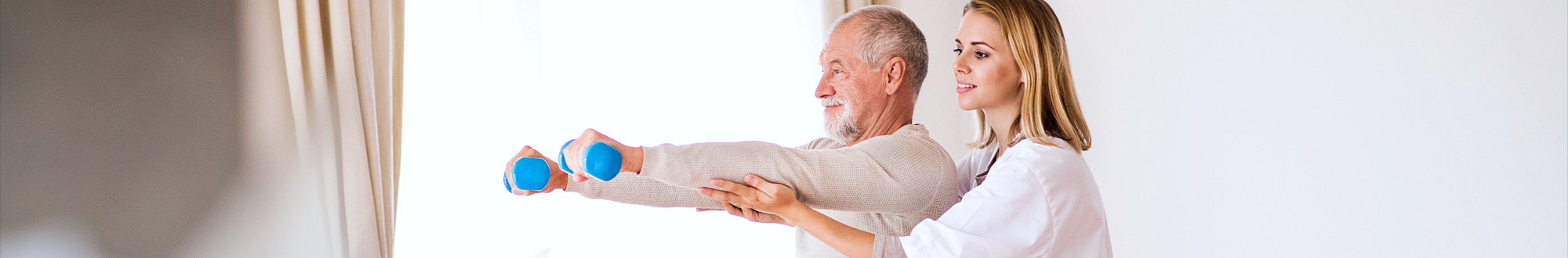 caregiver helping senior man stretch