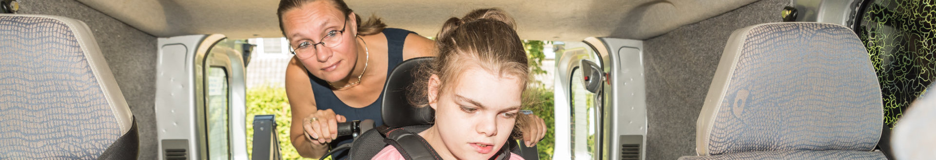 woman with girl at inside the car